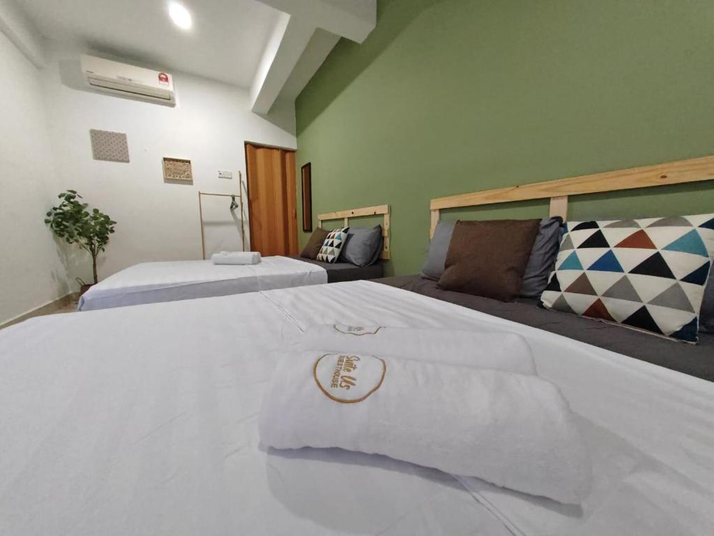 Postel nebo postele na pokoji v ubytování Suite Us Guesthouse Kubang Kerian