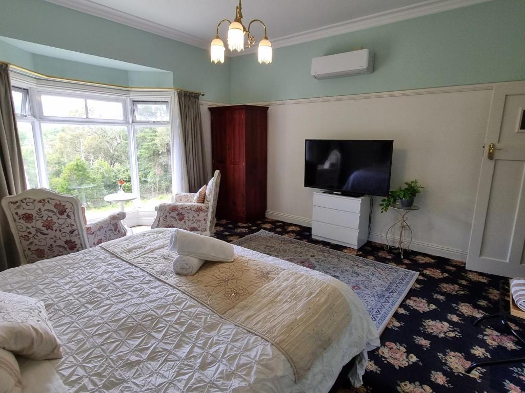 Postel nebo postele na pokoji v ubytování Rosebank Guesthouse