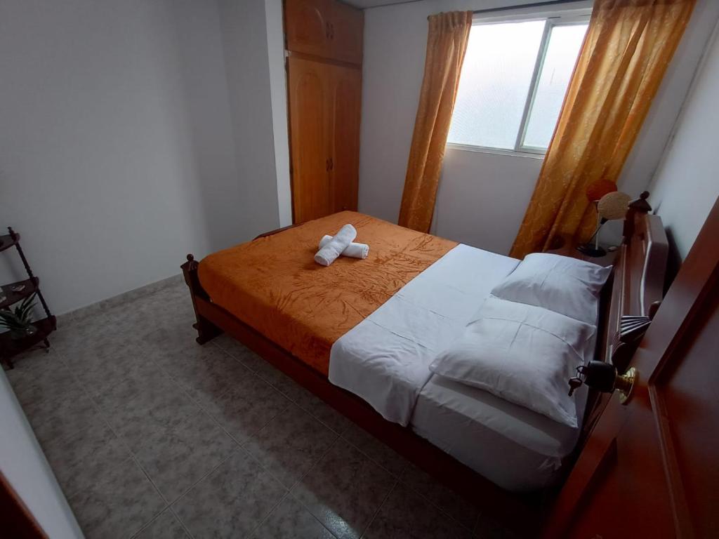 Postel nebo postele na pokoji v ubytování Hospedaje Centro Termales