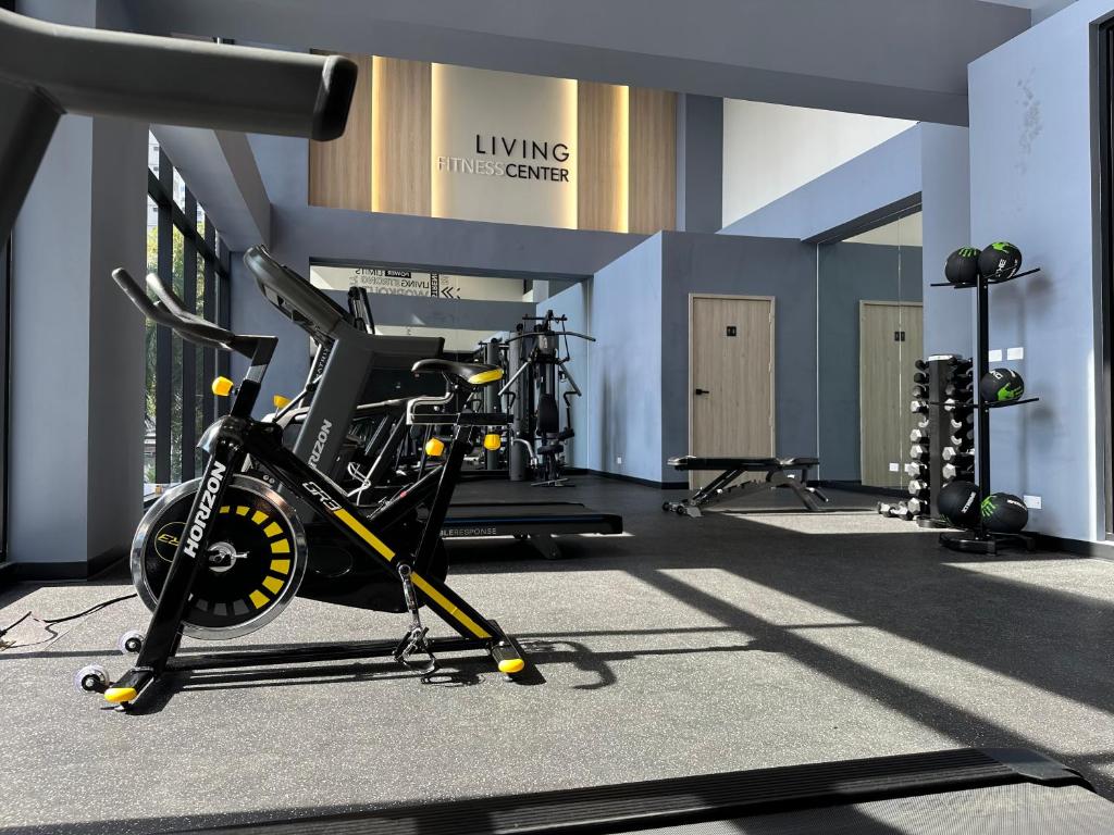 a gym with a bike and several tread machines at Apartamento en Panama in Panama City