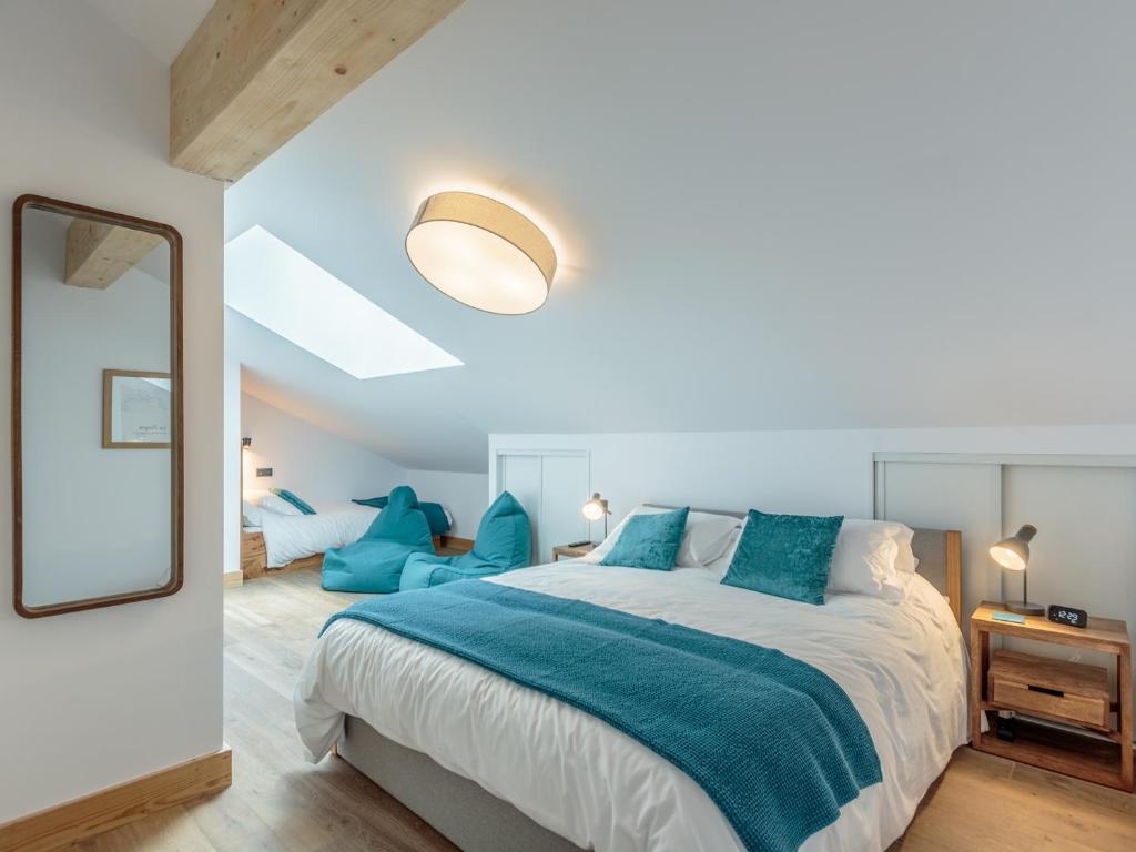 a bedroom with a large bed and a mirror at Appartement Champagny-en-Vanoise, 5 pièces, 10 personnes - FR-1-638-24 in Champagny-en-Vanoise