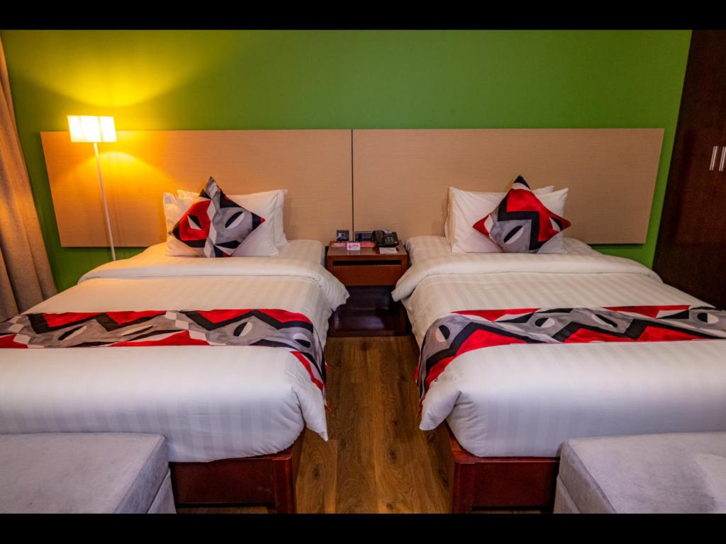Postel nebo postele na pokoji v ubytování Kojo Hotels Cebu-Mandaue