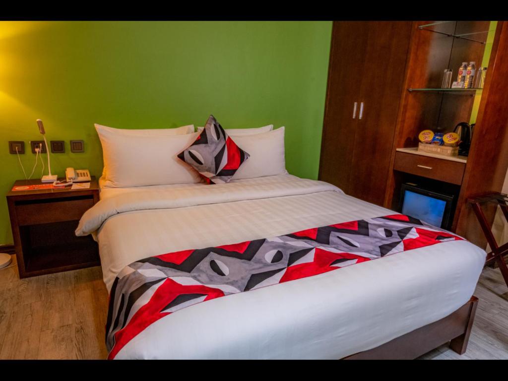Postel nebo postele na pokoji v ubytování Kojo Hotels Cebu-Mandaue
