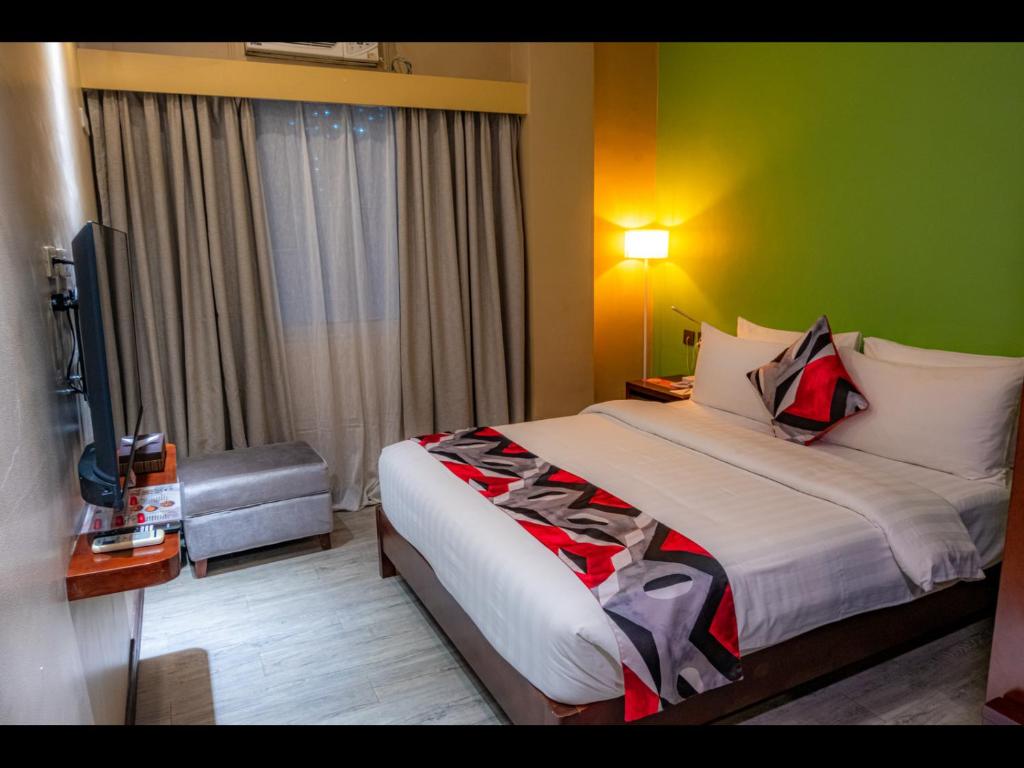 Postel nebo postele na pokoji v ubytování Kojo Hotels Cebu-Mandaue