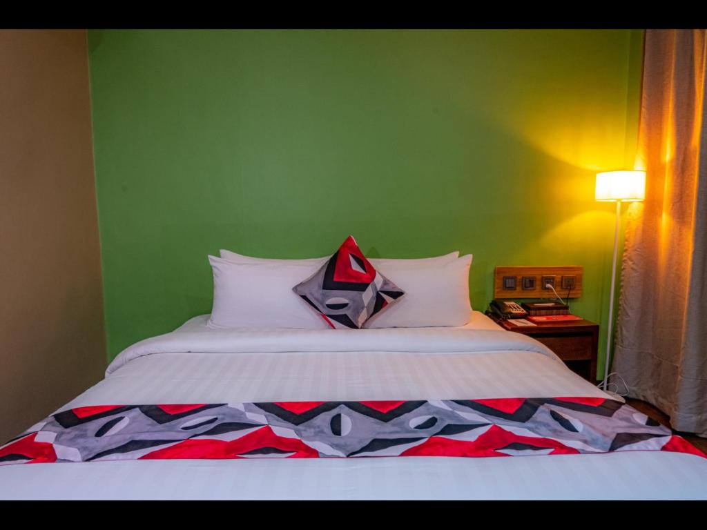Postel nebo postele na pokoji v ubytování Kojo Hotels Cebu-Mandaue