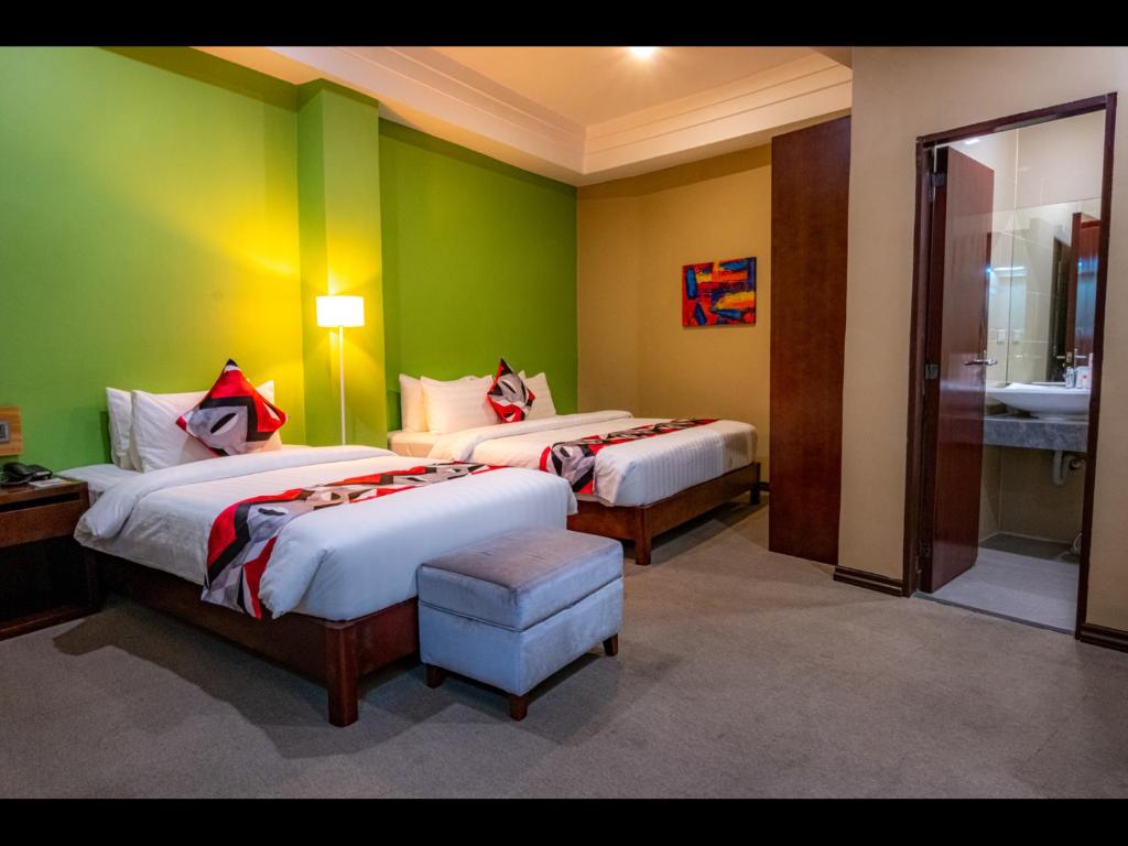 Postel nebo postele na pokoji v ubytování Kojo Hotels Cebu-Mandaue