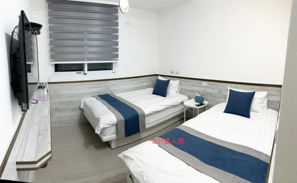Postel nebo postele na pokoji v ubytování Xiaomi Courtyard B&B
