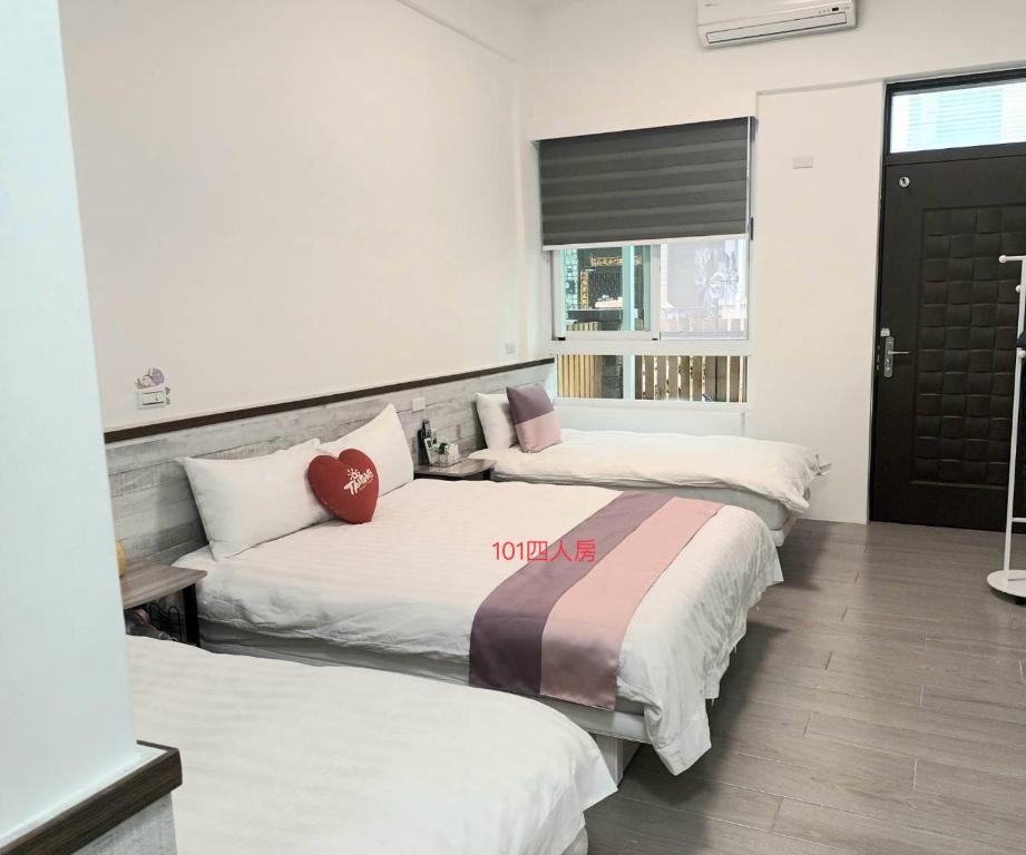 Postel nebo postele na pokoji v ubytování Xiaomi Courtyard B&B
