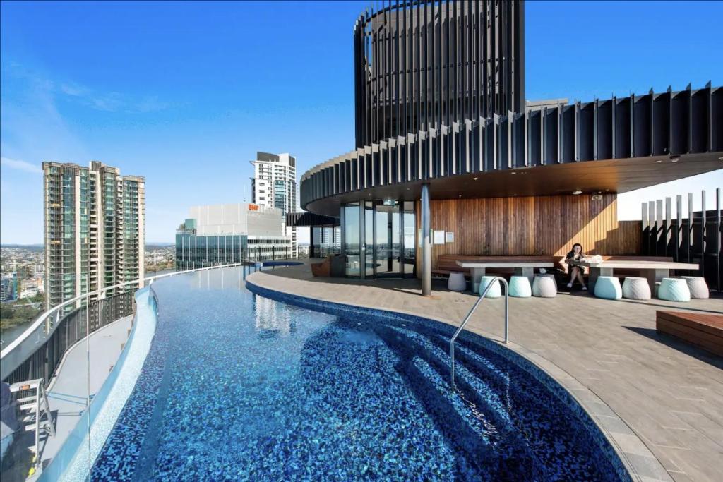 a swimming pool on the side of a building at Executively Inspired - The Hutt in Brisbane