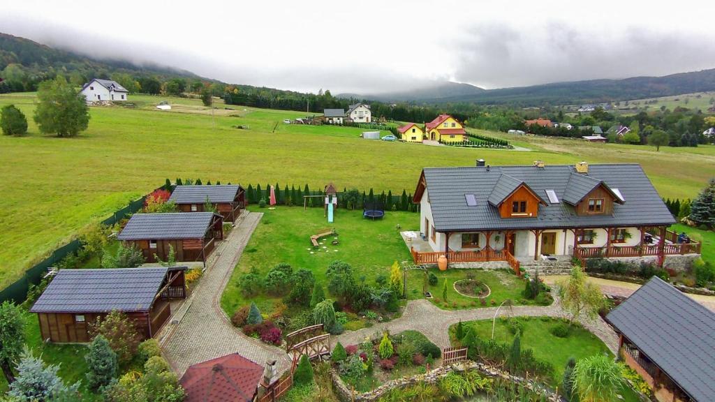 an aerial view of a house in a field at Słoneczne zbocze in Wysowa-Zdrój