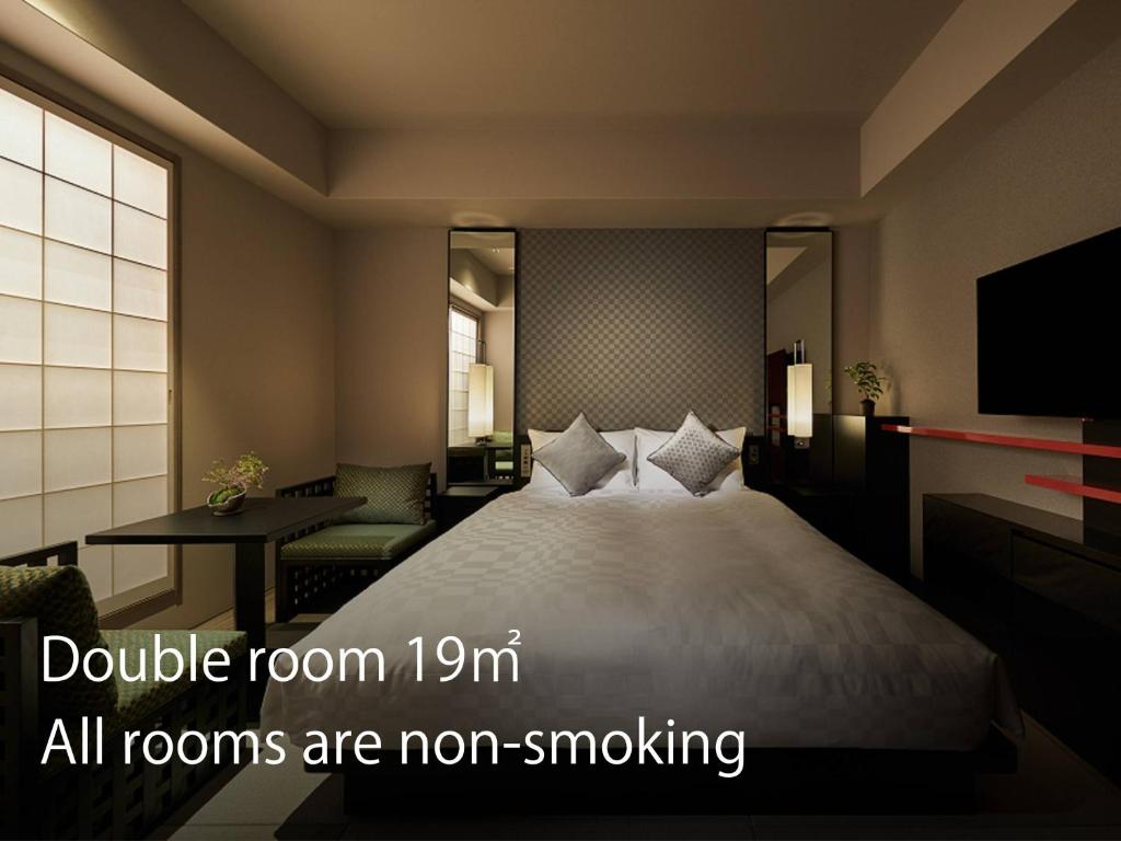 מיטה או מיטות בחדר ב-Hotel Resol Trinity Kyoto