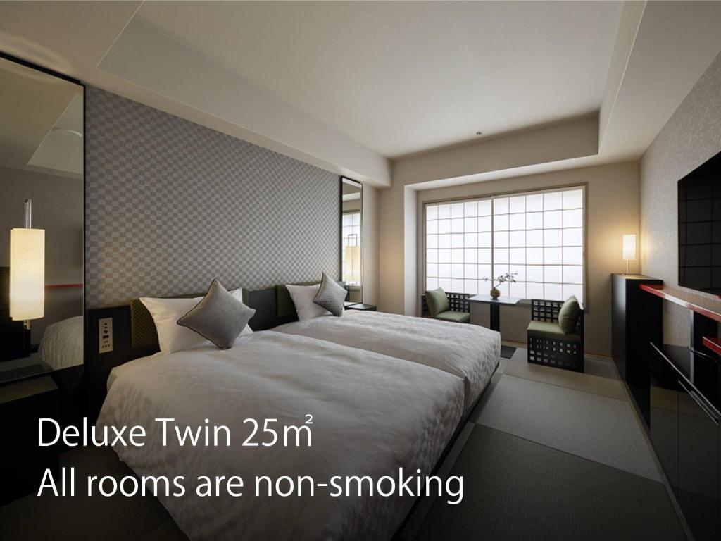 מיטה או מיטות בחדר ב-Hotel Resol Trinity Kyoto