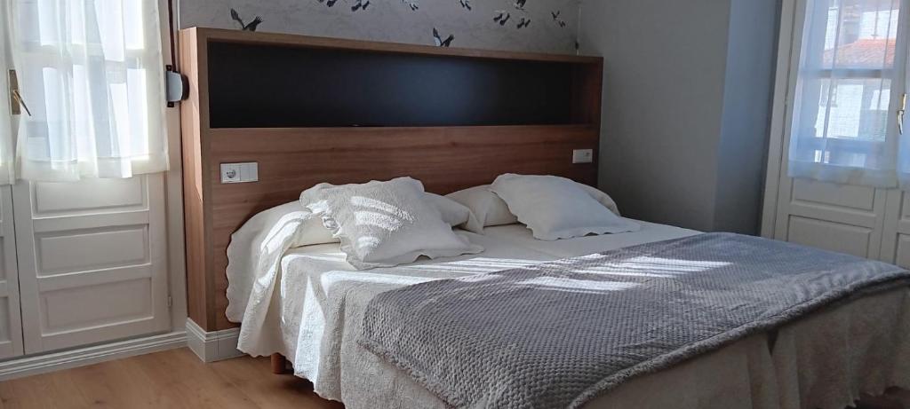 Postel nebo postele na pokoji v ubytování Hotel El Pescador