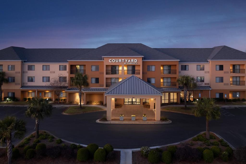 a rendering of a courtyard hotel at night at Courtyard by Marriott Panama City in Panama City