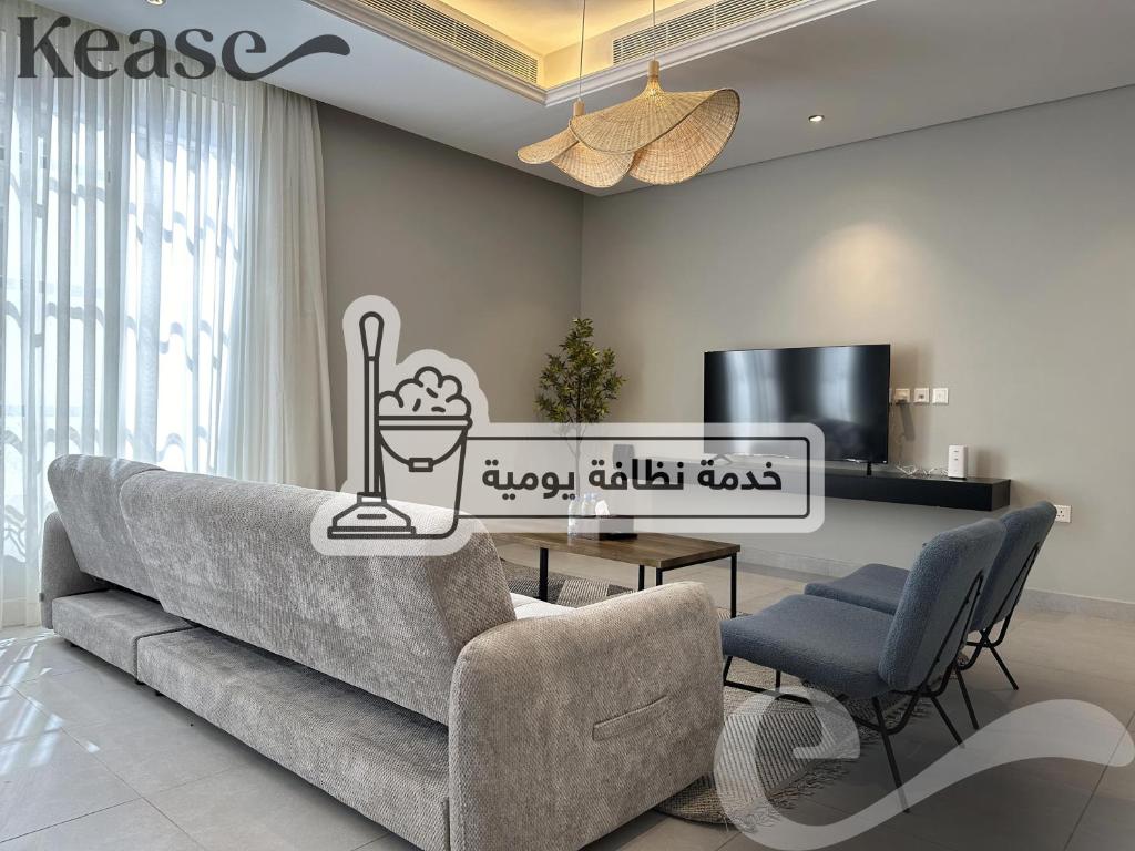 a living room with a couch and a table at Kease Hittin N-12 Lusso Hejaz Balcony GZ83 in Riyadh