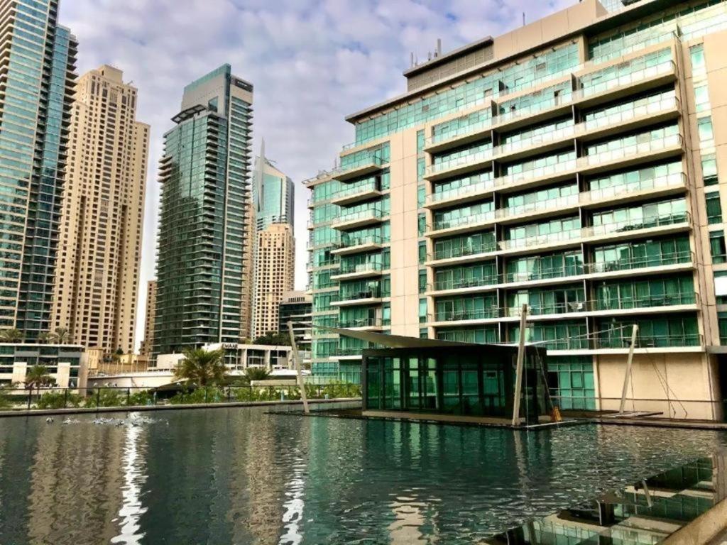 a large building in a city with tall buildings at Al Majara, Tower 1, Dubai Marina in Dubai