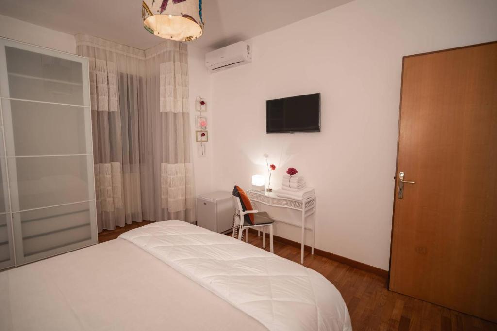 Postel nebo postele na pokoji v ubytování B&B CASA GAGLIARDI