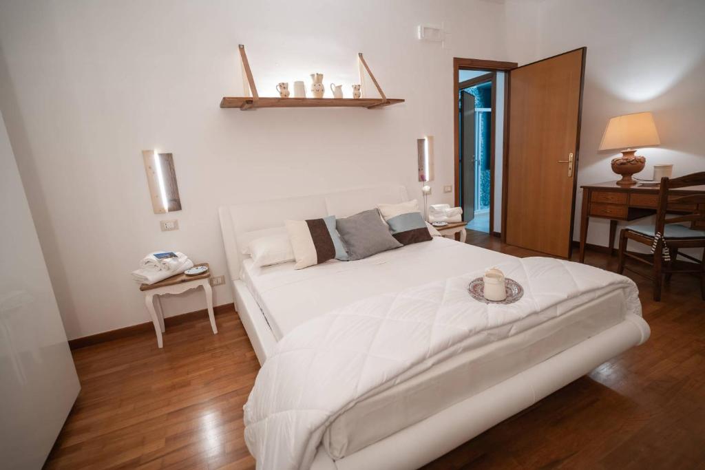 Postel nebo postele na pokoji v ubytování B&B CASA GAGLIARDI