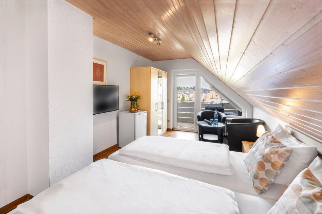 Postel nebo postele na pokoji v ubytování Hotel Garni Sonnengruss