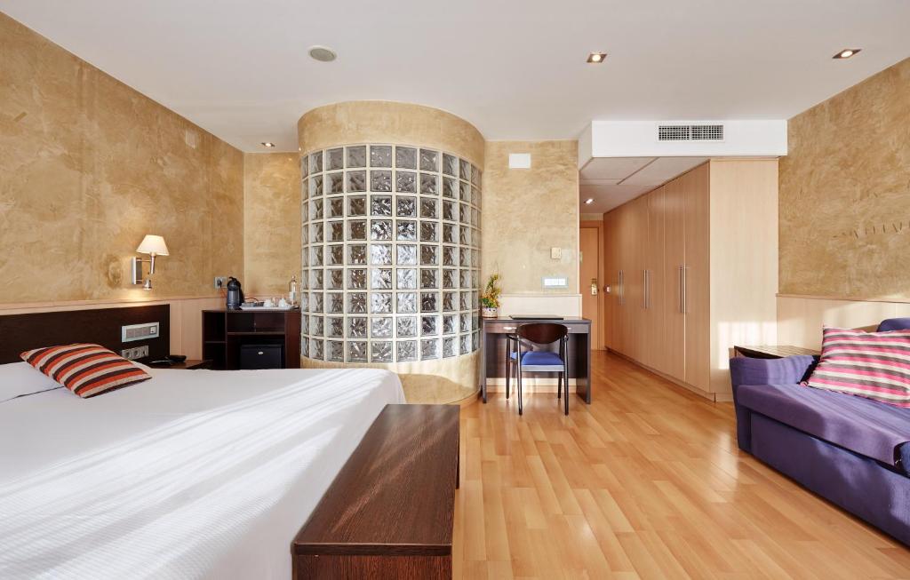A bed or beds in a room at Hotel Samba