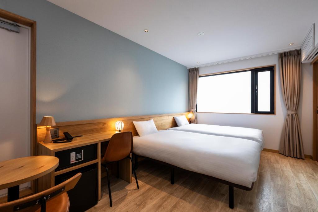 Postel nebo postele na pokoji v ubytování hotel Bell・Kyoto