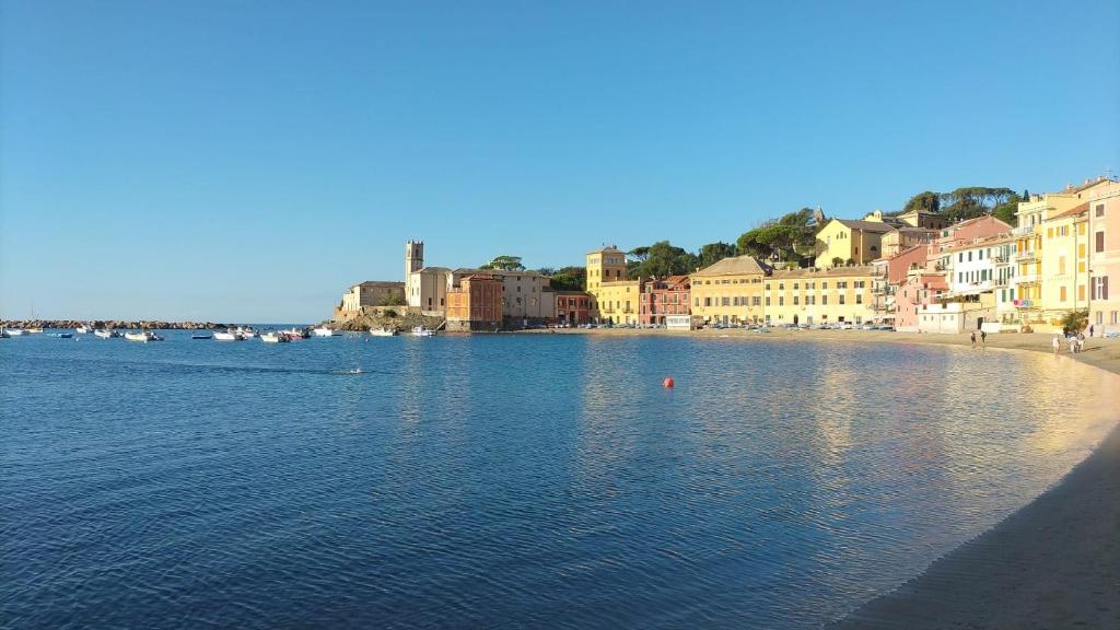 a view of a body of water with buildings and houses at Casa di Ermes in Sestri Levante