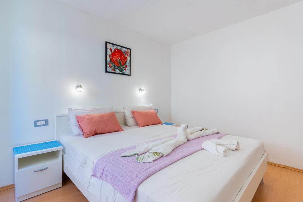 Postel nebo postele na pokoji v ubytování Guesthouse Romana