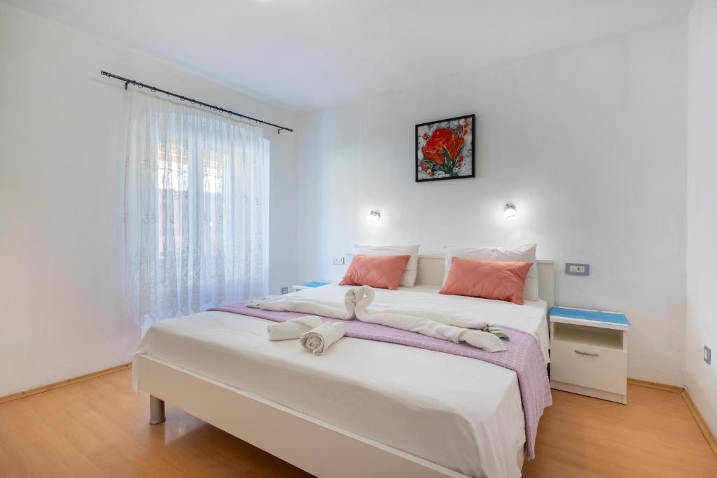 Postel nebo postele na pokoji v ubytování Guesthouse Romana