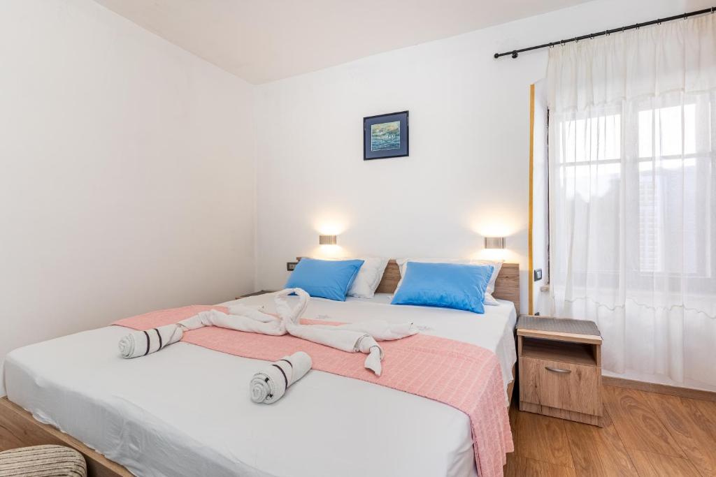 Postel nebo postele na pokoji v ubytování Guesthouse Romana