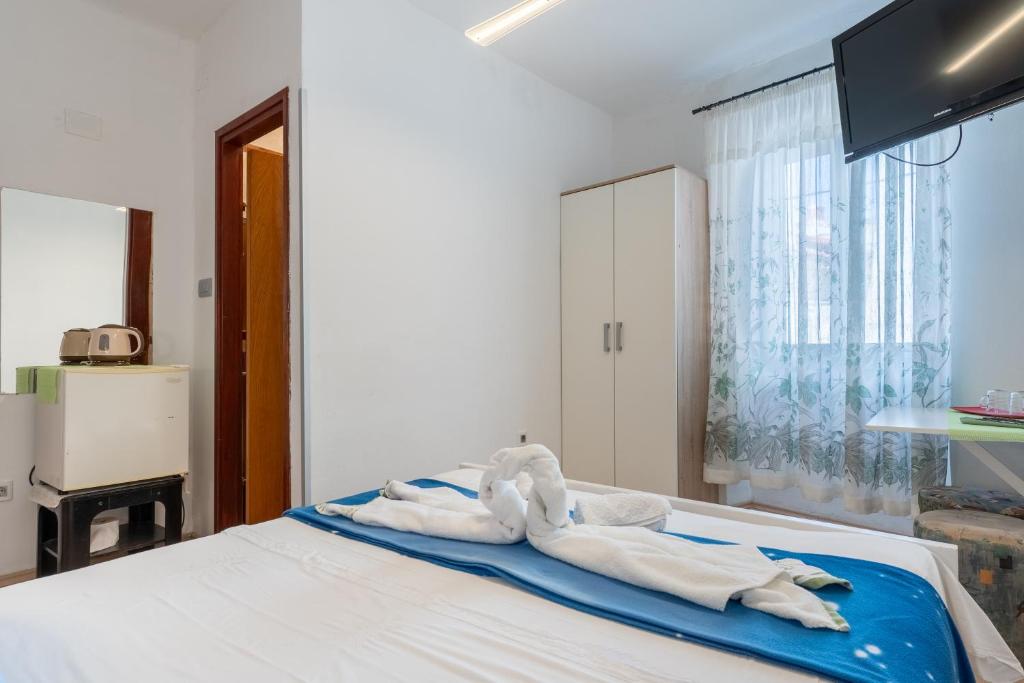 Postel nebo postele na pokoji v ubytování Guesthouse Romana