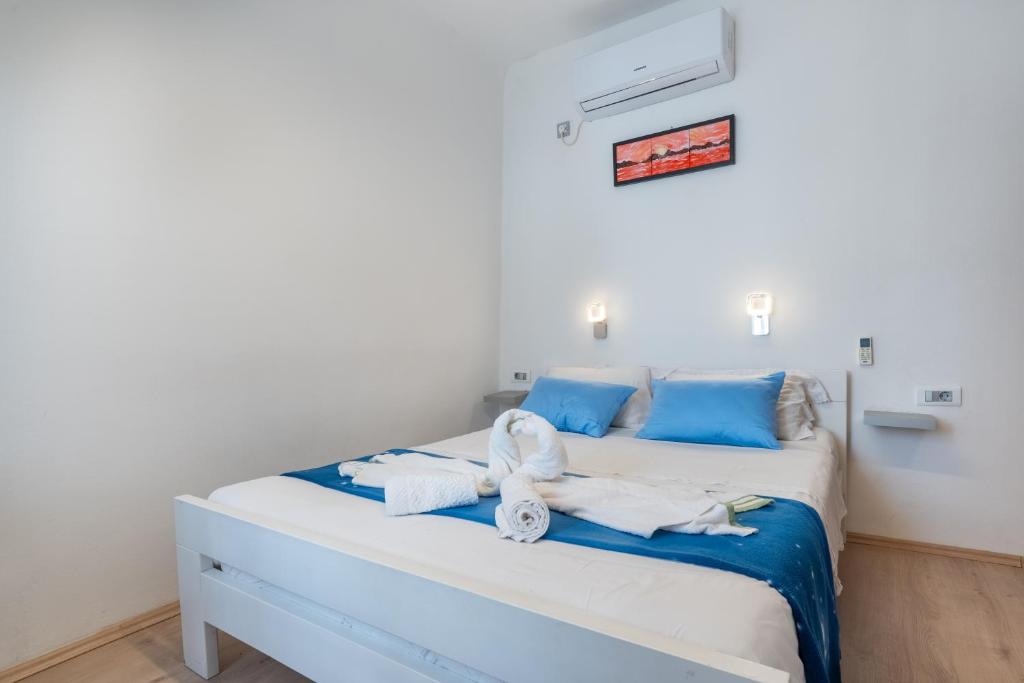 Postel nebo postele na pokoji v ubytování Guesthouse Romana