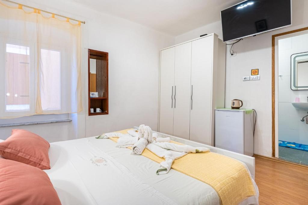 Postel nebo postele na pokoji v ubytování Guesthouse Romana