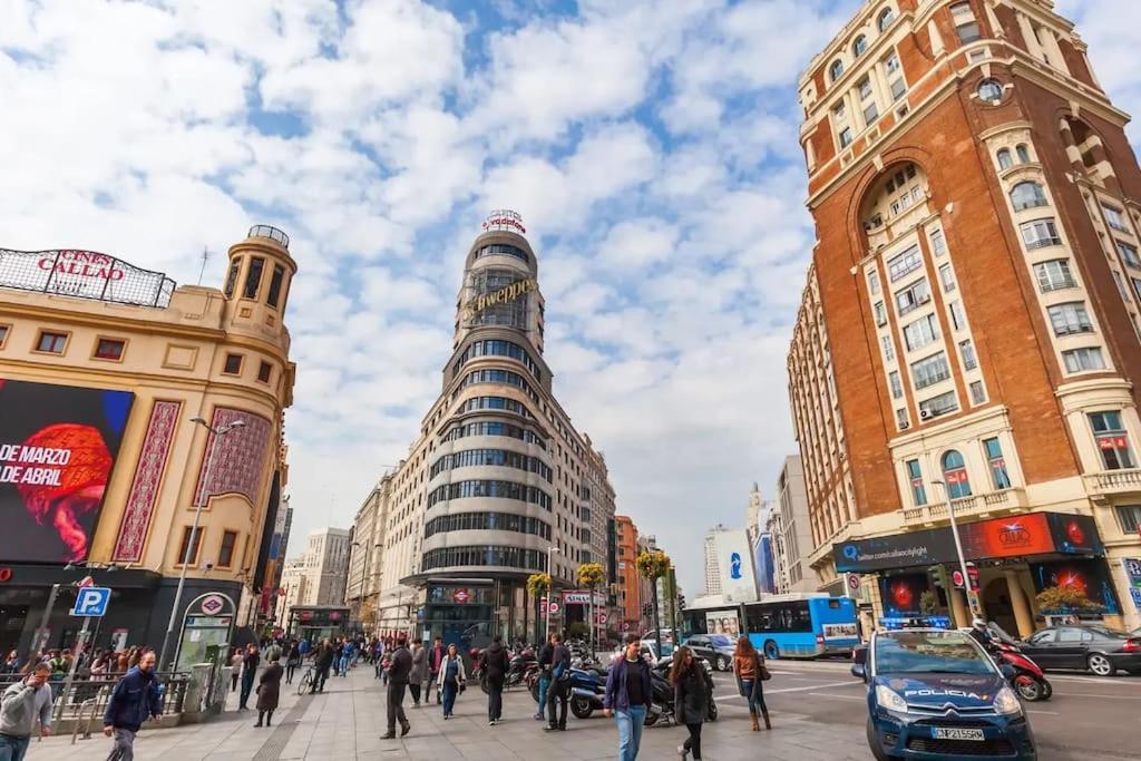 a busy city street with pedestrians and buildings at Punta me Loft in the best location of Madrid Downtown in Madrid