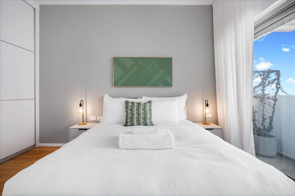 Postel nebo postele na pokoji v ubytování KG4 LUX Apartments