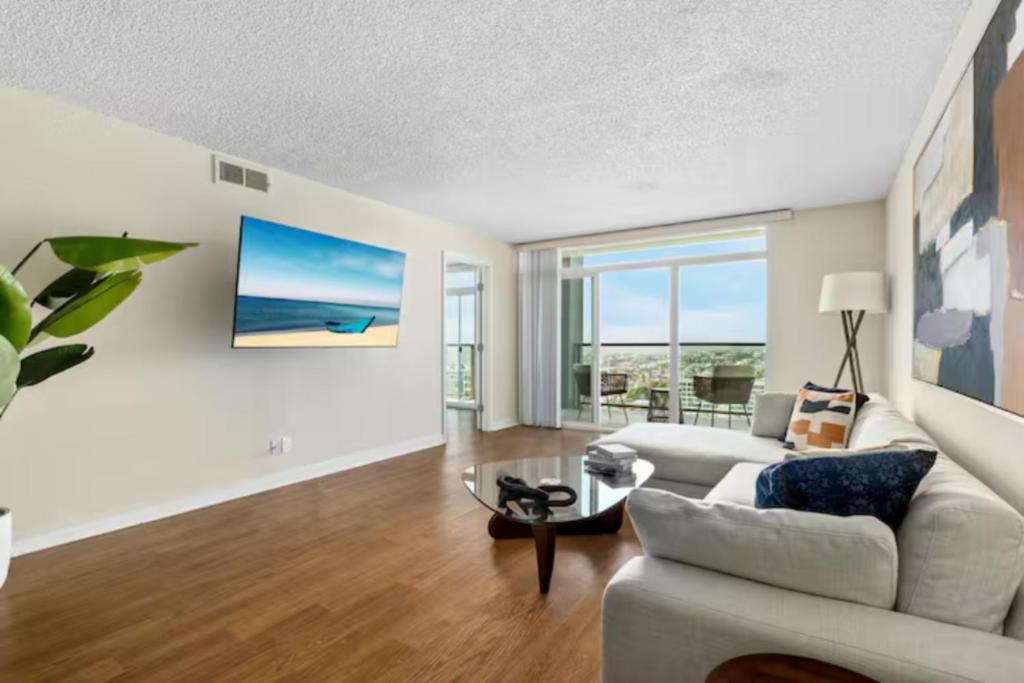 a living room with a couch and a table at Ocean View Luxurious Retreat Full 3Bedroom Marina in Los Angeles
