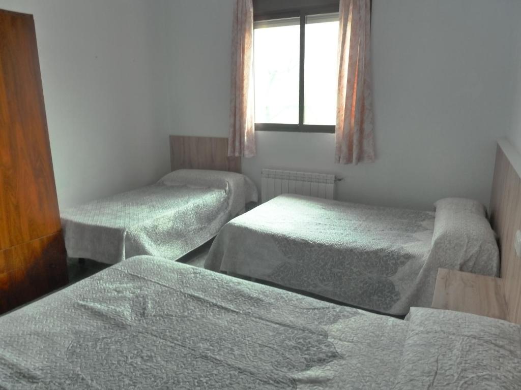 Postel nebo postele na pokoji v ubytování Apartamentos Casa FERMINA - A 2 horas de las pistas de esquí