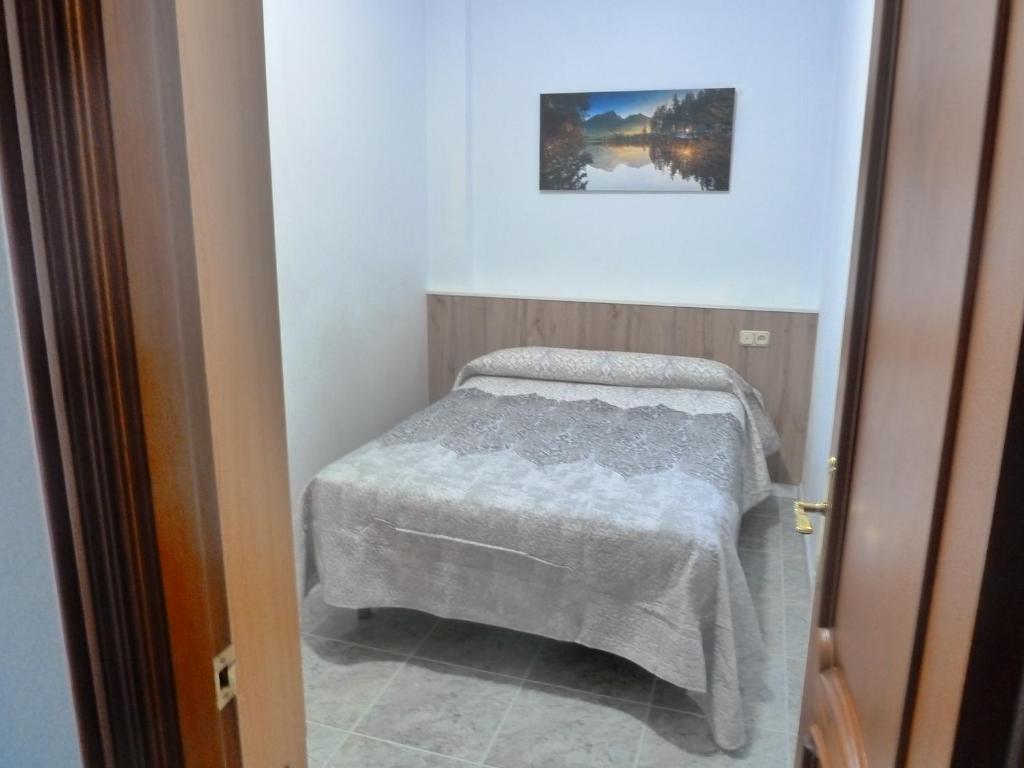 Postel nebo postele na pokoji v ubytování Apartamentos Casa FERMINA - A 2 horas de las pistas de esquí