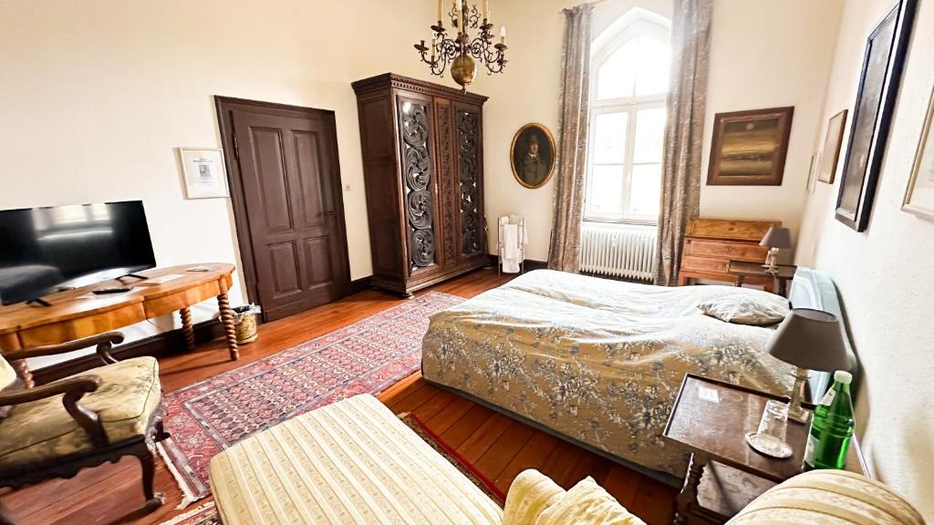 Postel nebo postele na pokoji v ubytování Burg Satzvey