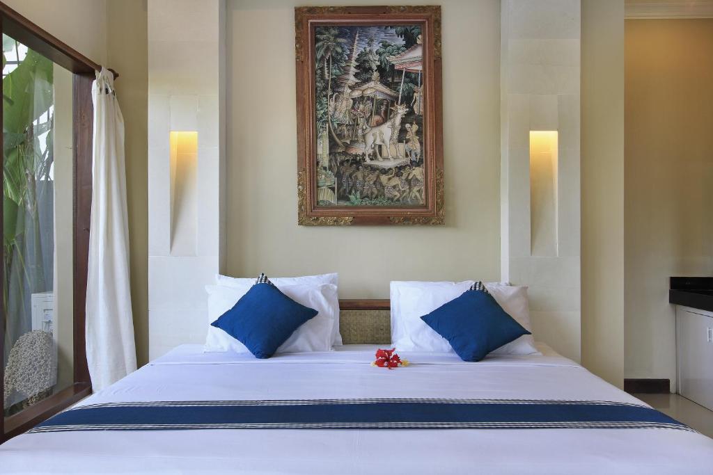 Postel nebo postele na pokoji v ubytování Nang Ade Villa by Pramana Villas