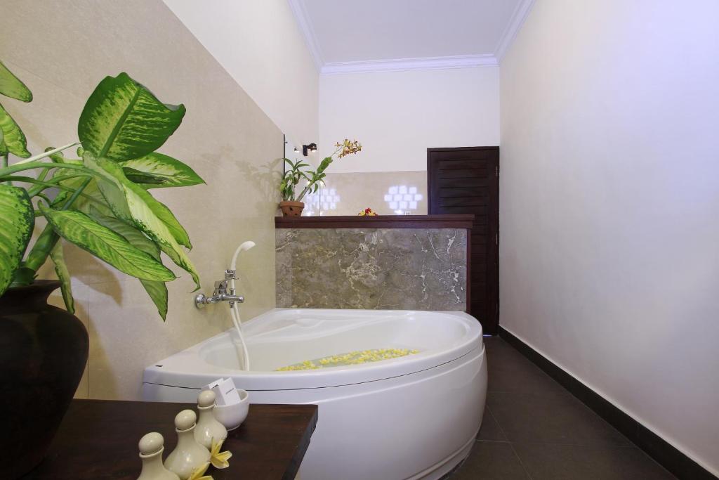 Koupelna v ubytování Nang Ade Villa by Pramana Villas