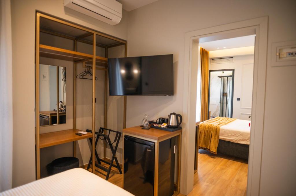 Posteľ alebo postele v izbe v ubytovaní Aggelos Hotel