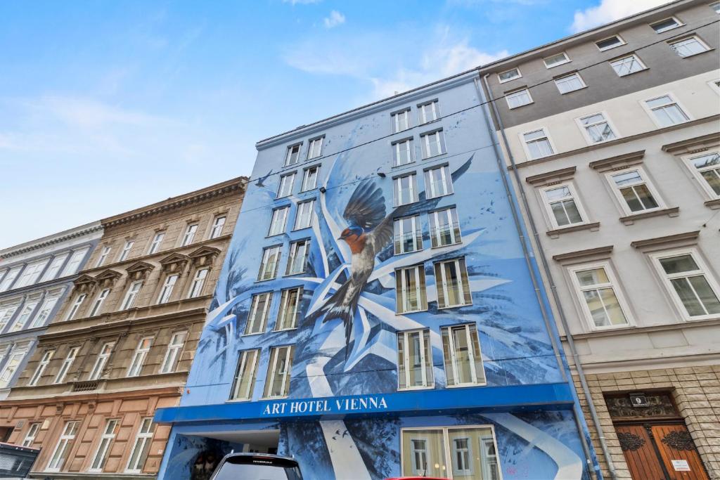 a building with a painting on the side of it at Art Hotel Vienna in Vienna