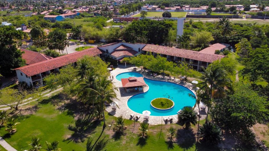 an aerial view of a resort with a swimming pool at Angá Beach Hotel in São Miguel dos Milagres