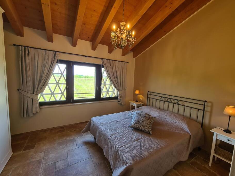 Ein Bett oder Betten in einem Zimmer der Unterkunft Appartamentino in az agricola Le vigne del Moretto