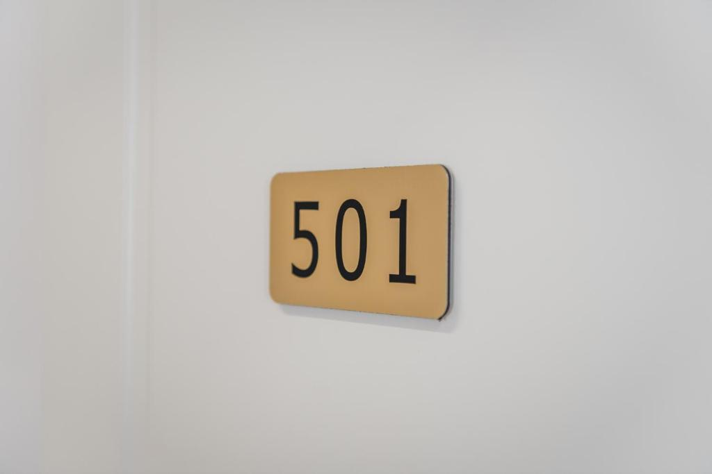 a digital clock on a wall displaying the time at Relax Inn Hotel Durres in Durrës