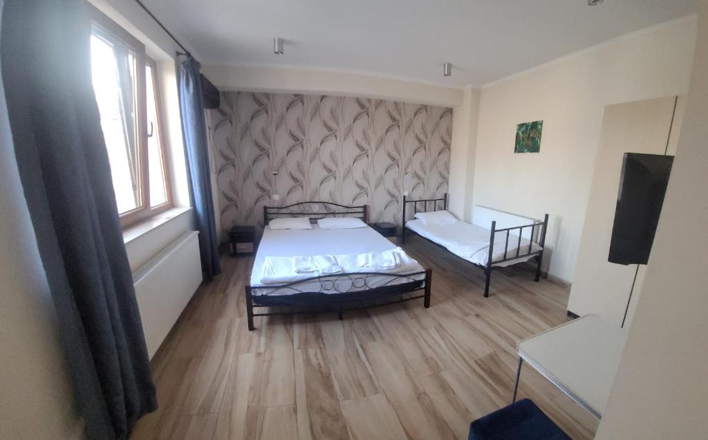 Postel nebo postele na pokoji v ubytování Byzanthin Hostel