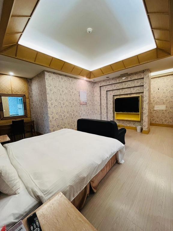 Postel nebo postele na pokoji v ubytování Walker Hotel - Chengde