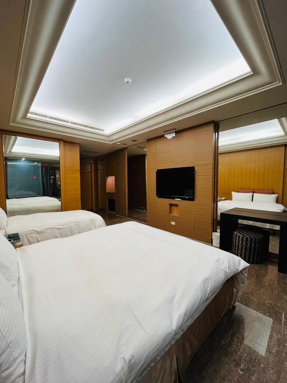 Postel nebo postele na pokoji v ubytování Walker Hotel - Chengde