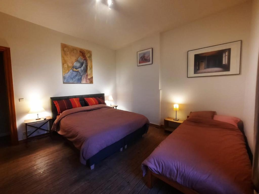 Ένα ή περισσότερα κρεβάτια σε δωμάτιο στο Que du Bonheur 2.0