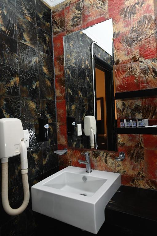 Koupelna v ubytování Aktis Hotel